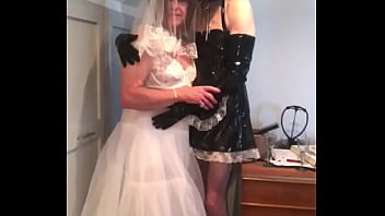 Bride Carole is prepared for her nuptials by her PVC maid